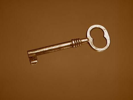 A Sepia toned photograph of an old key