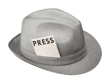 Vintage trilby hat with press pass isolated on white