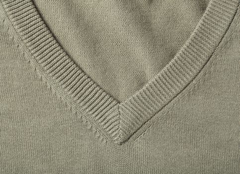 v-neck of a green cotton knitwear sweater