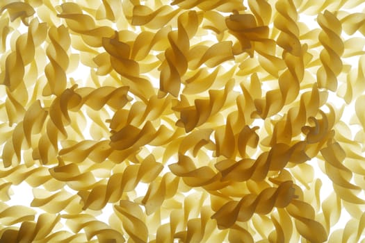 Uncooked pasta fusilli aka. twisted spaghetti. 