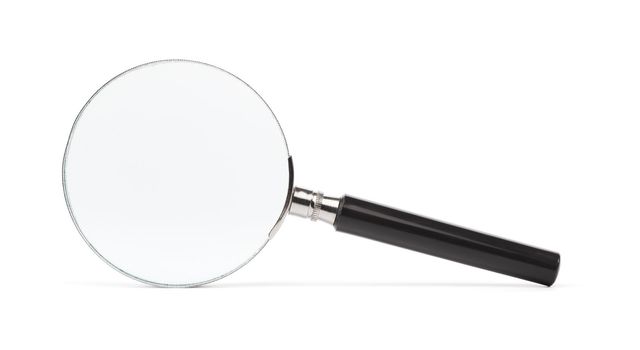 Old magnifying glass isolated on white with natural shadow