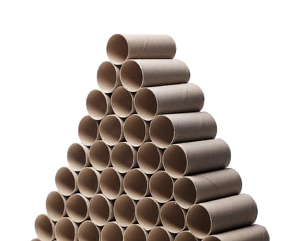 Empty toilet paper rolls stacked as a pyramid.