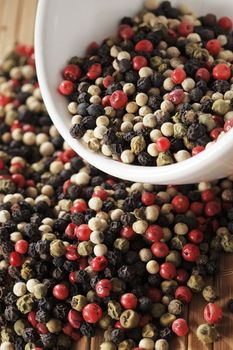 A mix of black, green, red and white peppercorns.