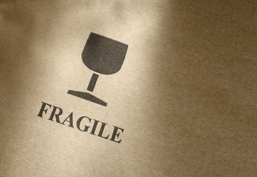 "Fragile" symbol printed on brown cardboard box