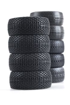 stack of spare auto tires on a white background