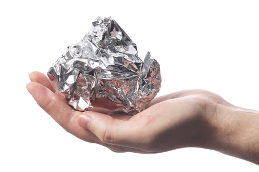 Hand holding a crumpled aluminum foil wrap
