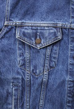 Detail of a blue denim jeans jacket.