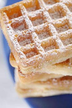 Waffles with powder sugar sprinkled on top