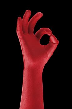 a strange red gloved hand doing OK sign