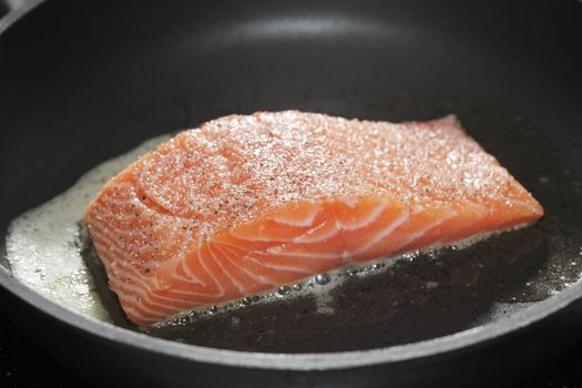 Salmon fillet on a frying pan