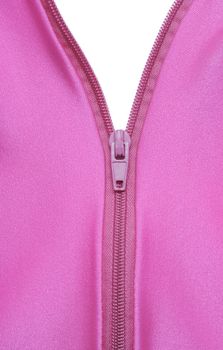 Zipper of a fuchsia colored garment revealing white background