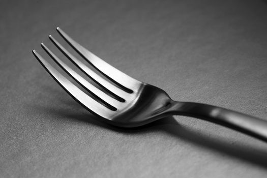 Black and white image of a fork. Very shallow depth-of field.