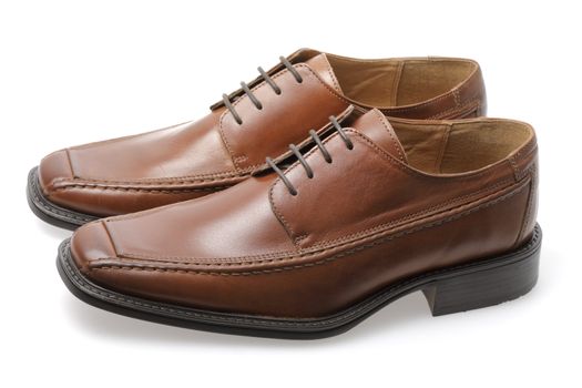 An isolated pair of brown men's leather shoes