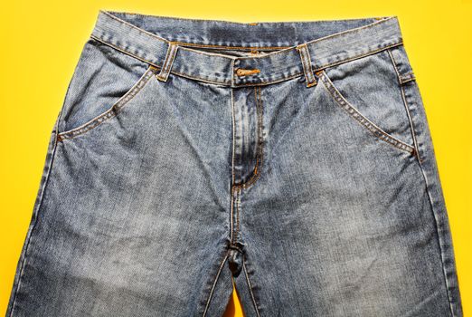 Jeans on a yellow background