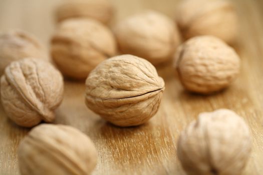 walnuts on wooden surface, very short depth-of-field