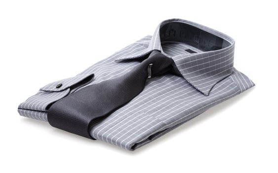 A Plaid shirt with a silk tie folded neatly