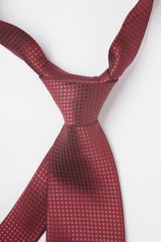Knot of a red silk necktie
