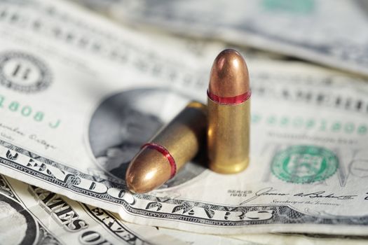 9mm handgun cartridges and some old US dollar bills