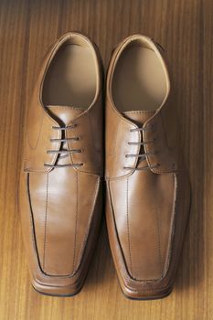 A Pair of mens brown leather shoes