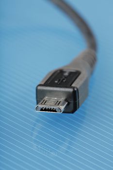 Micro USB cable connector used in cell phones for power and data.