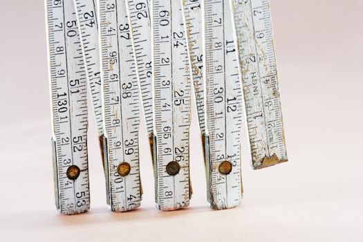 Old worn folding carpenter's ruler in closeup