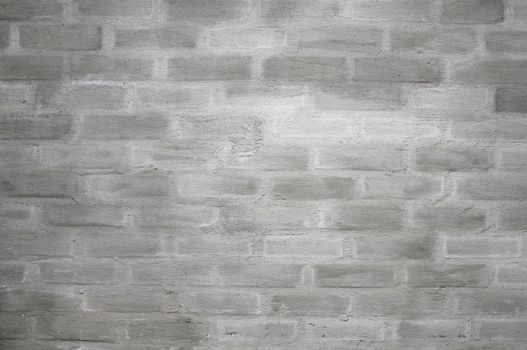 A grey plastered brick wall