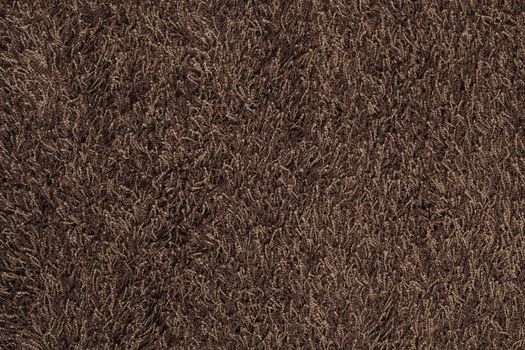 New brown fluffy rug background texture