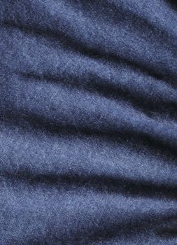 Wrinkled blue denim fabrick background texture