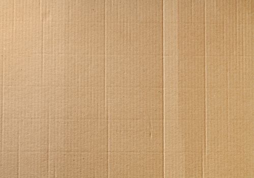 Corrugated cardboard background with some wrinkles