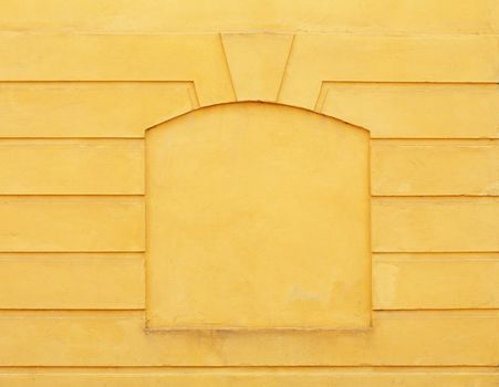 Yellow concrete wall with a "frame"