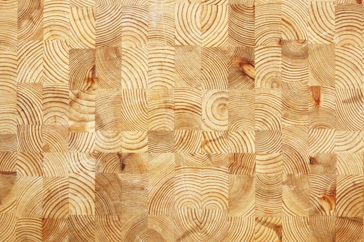 A scratched wooden cutting board, suitable for background texture