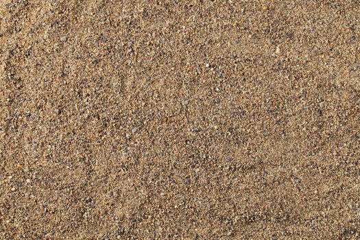 Texture made of natural coarse sand from the sea.