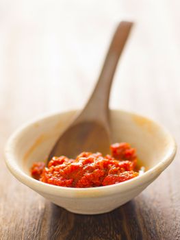 close up of a bowl of sambal chili sauce