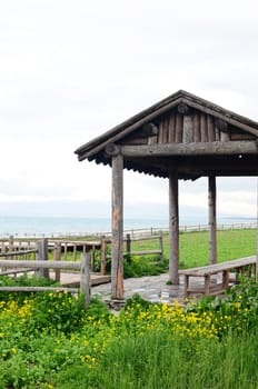 Landscape of wooden pavilion and fence in the grassland