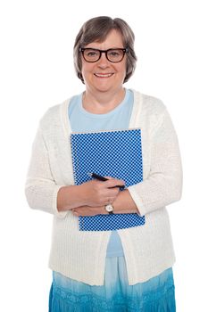 Happy aged woman holding notebook and pen isolated over white