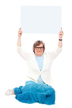 Seated representative holding blank white billboard over her head