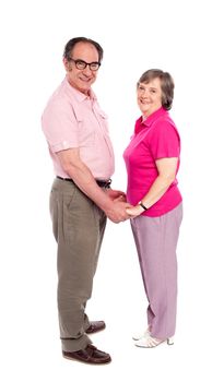Happy matured couple in love holding hands. Full length portrait