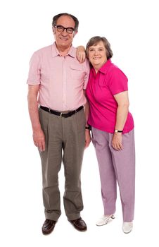 Full length shot of an aged cheerful couple isolated on white background