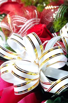 Holiday white ribbon on the bunch of flowers