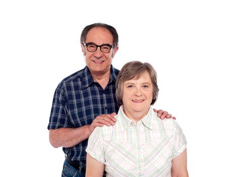 Happy senior lovable couple posing against white background