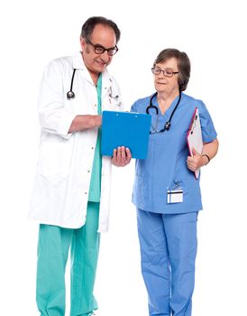 Doctors discussing a medical report isolated over white