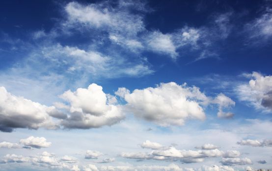 white clouds on blue sky in season