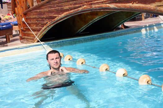 posing in the swimming pool for the photographer