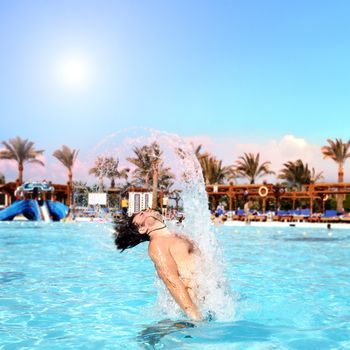 posing in the swimming pool for the photographer