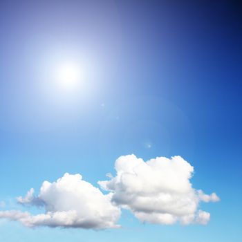 white clouds on blue sky in season