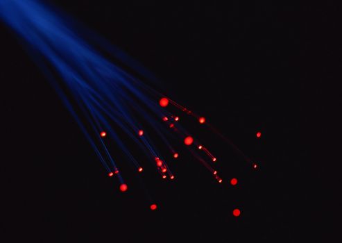 Internet technology concept with fiber optics on black background