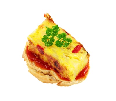 appetizer of spanish omelet on a slice of bread smeared with tomato cut off and isolated