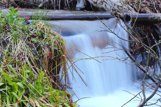 waterfall up in the mountains near the spring