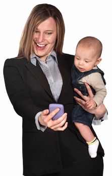 Pretty lady with baby looking at her telephone screen