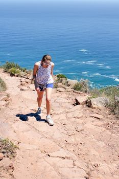 Woman hiking On Lions Head, Cape Town, South Africa